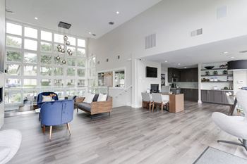 A living room filled with furniture and a large window