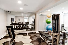 Columbia apartment for rent - a spacious fitness room with weights and other exercise equipment at Hamilton at Kings Place, Columbia, MD, 21046