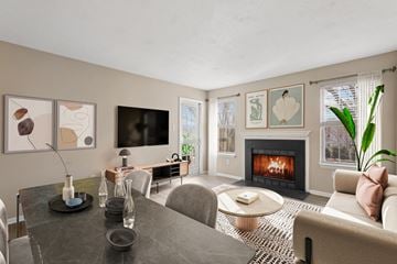 Columbia apartment for rent - a living room with a fireplace and a table and chairs