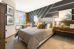 Hanover apartment for rent - a bedroom with a bed and a desk in front of a window