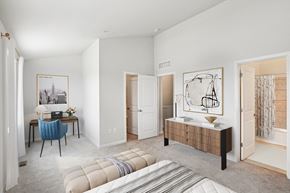 Baltimore triplex for rent - a bedroom with a bed and a desk and a mirror at Refinery Row, Baltimore, MD 21224