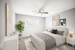 Landover apartment for rent - Bright bedroom with neutral decor and ceiling fan at Villages at Morgan Metro Apartments, Landover, MD
