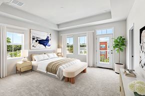 Elkridge townhouse for rent - a bedroom with a bed and a large window
