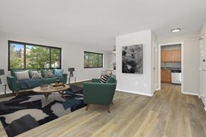 Wheaton apartment for rent - a living room with a couch and a chair at Earle Manor Apartments, Wheaton, Maryland