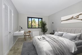 Wheaton apartment for rent - a bedroom with a bed and a desk and a window at Earle Manor Apartments, Maryland
