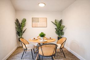 Capitol Heights apartment for rent - A dining room with a table set for two and a plant on each side ighland Ridge Apartments, Capitol Heights, MD, 20743