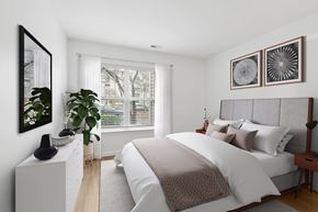 Owings Mills apartment for rent - Modern bedroom with neutral tones and large window at Park at Winterset Apartments, Owings Mills