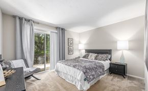 Columbia apartment for rent - A bedroom with a large bed and a window with curtains at Madison at Eden Brook, 21046