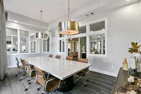 Farmers Branch apartment for rent - A conference room with a long table and chairs at Prairie Crossing, Farmers Branch, TX 75244