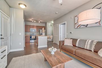 Woodbridge apartment for rent - A living room with a brown couch and a coffee table.