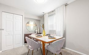 Columbia apartment for rent - Dining room with round mirror and white table at The Brook At Columbia Apartments, Columbia