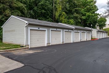 Row of private detached garages with overhead doors