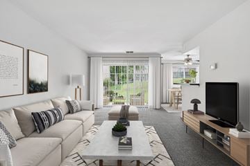 Columbia apartment for rent - A living room with a white couch and a grey coffee table.