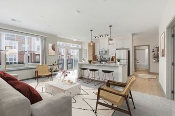 Hanover apartment for rent - a living room with a kitchen and a couch and a table
