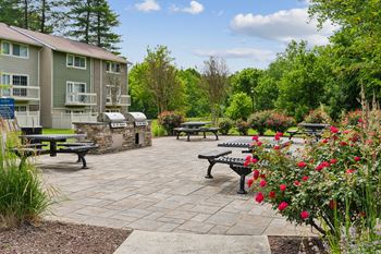 Outdoor grilling area with paver patio and seating