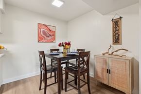 Chandler apartment for rent - A dining room with a wooden table and chairs at Riviera Park, Chandler Arizona