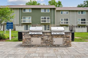 Outdoor grilling area with built in stone barbecues