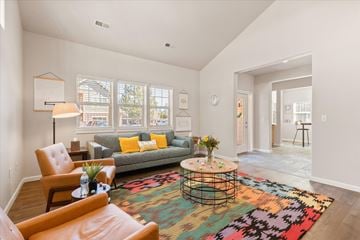 Bend apartment for rent - a living room with a gray couch and a colorful rug
