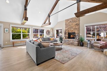 Bend apartment for rent - a living room with couches and chairs and a fireplace