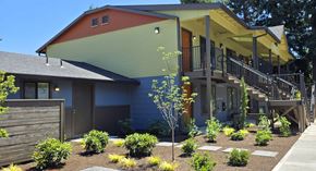 Portland apartment for rent - A modern house with a red, green, and yellow exterior.