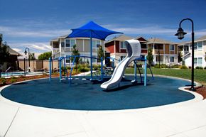 Brentwood apartment for rent - a playground with a slide in front of houses