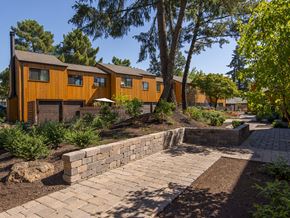 Gladstone apartment for rent - a brick walkway leading up to a house with trees and a courtyard