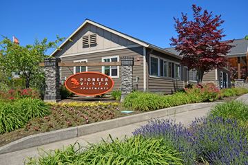 Ridgefield apartment for rent - A building with a sign that says Pioneer Village Apartments.