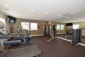 Ridgefield apartment for rent - A gym with treadmills, weights, and exercise equipment.