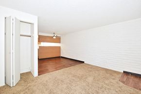 Mt. Home apartment for rent - an empty living room with white walls and wood flooring