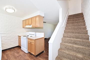 Mt. Home apartment for rent - a kitchen with a stove and a staircase in a house