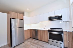 Portland apartment for rent - A modern kitchen with a stainless steel refrigerator and oven.
