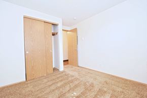 Tualatin apartment for rent - a bedroom with an open door and a carpeted floor
