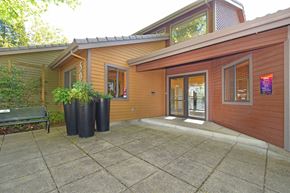 Beaverton apartment for rent - A house with a brown exterior and a grey roof.