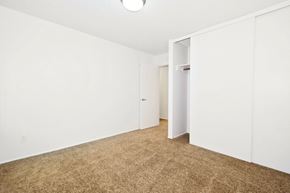 Beaverton apartment for rent - a bedroom with white walls and carpet and a closet