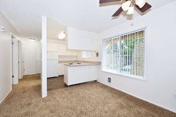 Beaverton apartment for rent - a white kitchen with a large window and a white counter top