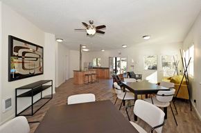 Portland apartment for rent - A modern dining room with a large table and chairs.