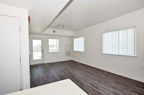Oroville apartment for rent - a bedroom with hardwood floors and white walls