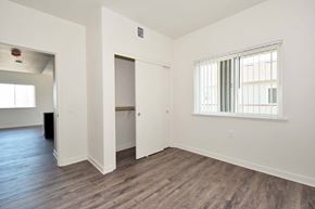 Oroville apartment for rent - a bedroom with hardwood floors and white walls