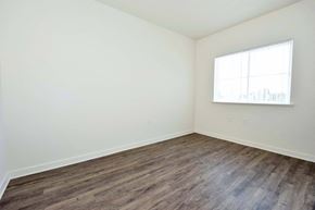 Oroville apartment for rent - a bedroom with white walls and a window