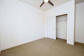Truckee apartment for rent - a bedroom with a closet and a ceiling fan