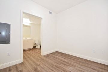 Burlingame apartment for rent - the living room of an apartment with a tv and a bathroom