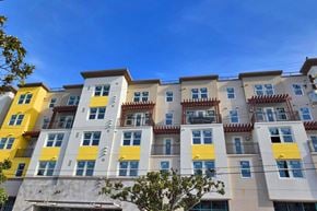 Burlingame apartment for rent - a typical apartment building with yellow and white facade