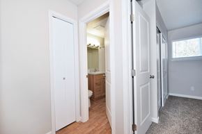 Portland apartment for rent - 20th and Brooklyn  a hallway with two doors and a bathroom in the background