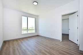 Santa Rosa apartment for rent - a bedroom with hardwood floors and white walls