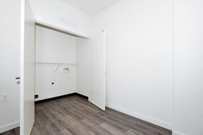Chico apartment for rent - a bedroom with white walls and wood flooring and a closet