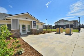 Oroville apartment for rent - a building with a concrete walkway in front of it