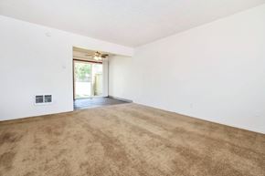 Gresham apartment for rent - a living room with white walls and a beige carpet