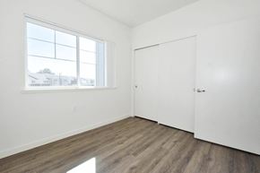 Oroville apartment for rent - a bedroom with a large window and white walls