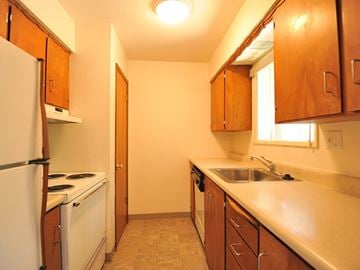 Gresham apartment for rent - a kitchen with a stove and a sink and a refrigerator