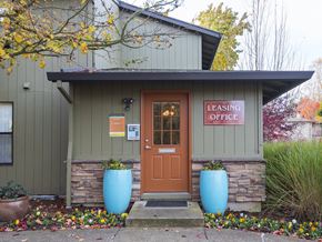 Tualatin apartment for rent - a small building with a orange door and a sign that reads leasing office